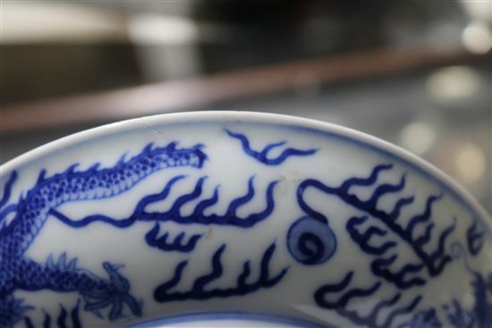 A Chinese blue and white dragon dish, diameter 16.3cm, some damage